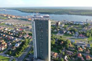 an aerial view of a city with a tall building at Sea View Apartment in Klaipėda in Klaipėda