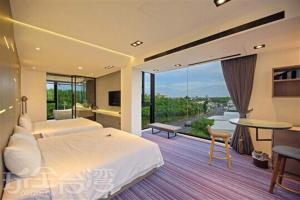 Rúm í herbergi á O2 Homestay