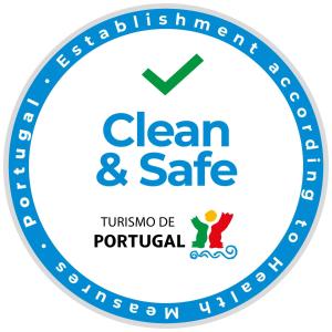 a blue clean and safe logo at A Casa D'Amelie in Faro