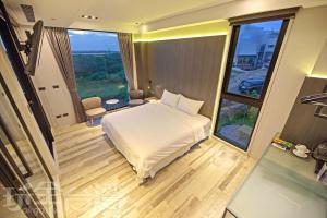 Rúm í herbergi á O2 Homestay