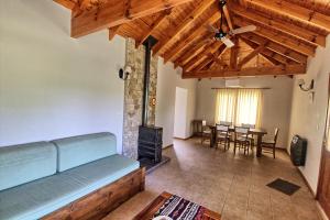 a living room with a couch and a fireplace at Casas de Campo Henin in Villa General Belgrano