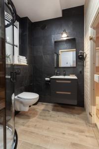 Kúpeľňa v ubytovaní Apartament JODEŁKA