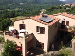 a house with a solar panel on the roof at Gîtes à COZZANO in Cozzano