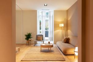 A seating area at DestinationBCN Universitat Apartments