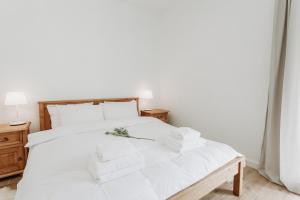 Posteľ alebo postele v izbe v ubytovaní Apartament JODEŁKA