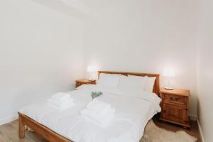 Posteľ alebo postele v izbe v ubytovaní Apartament JODEŁKA