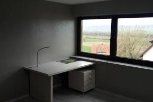 a white desk in a room with a window at Ferienwohnung Weserblick in Hessisch Oldendorf +1 photo