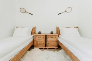 Posteľ alebo postele v izbe v ubytovaní Apartament JODEŁKA