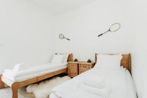 Posteľ alebo postele v izbe v ubytovaní Apartament JODEŁKA