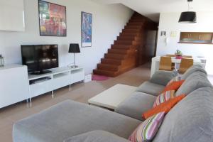 TV a/nebo společenská místnost v ubytování Casa Voltora