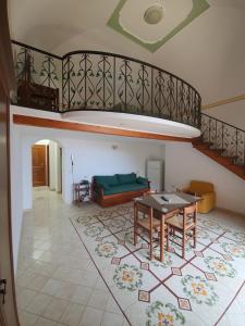 a living room with a couch and a table at Villa Celentano in Positano