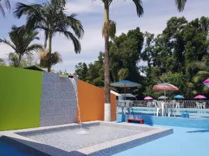 A piscina localizada em Pousada Paraíso das Águas ou nos arredores