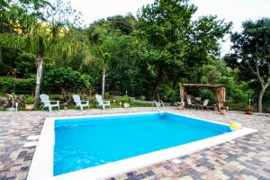 Bazén v ubytovaní Le Muse Country House - Gole Alcantara alebo v jeho blízkosti
