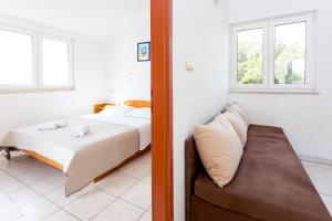 Posteľ alebo postele v izbe v ubytovaní AGA beach suites