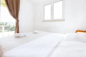 Posteľ alebo postele v izbe v ubytovaní AGA beach suites