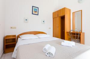Posteľ alebo postele v izbe v ubytovaní AGA beach suites
