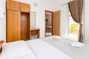 Posteľ alebo postele v izbe v ubytovaní AGA beach suites