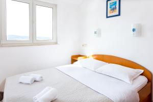 Posteľ alebo postele v izbe v ubytovaní AGA beach suites