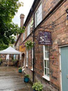 a sign on the side of a brick building at Jackfield Mill Ironbridge Gorge in Telford +9 photos