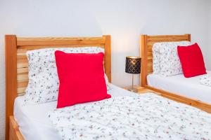 Posteľ alebo postele v izbe v ubytovaní Apartmány Nevädza