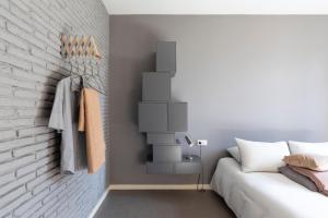 A bed or beds in a room at DestinationBCN Universitat Apartments
