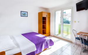 Posteľ alebo postele v izbe v ubytovaní AGA beach suites