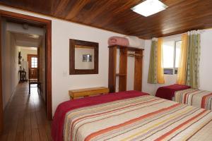 Ένα ή περισσότερα κρεβάτια σε δωμάτιο στο Hospedaria Brigite - Apartamento de Férias