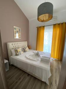 Postel nebo postele na pokoji v ubytování Christina Apartments