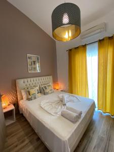 Postel nebo postele na pokoji v ubytování Christina Apartments