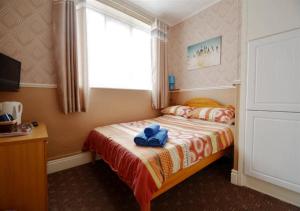 Cama o camas de una habitación en The Chelston Bed and Breakfast