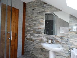 a bathroom with a sink and a mirror at La Maison Fleurie in Dieffenbach-au-Val +29 photos