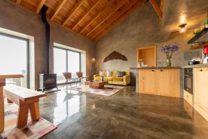 a large living room with a couch and a table at Rosa Chá in Santo Amaro