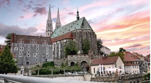 a large building with a church and a city at Ferienzimmer am Berzdorfer See Görlitz OT Tauchritz in Görlitz
