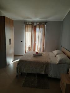 Posteľ alebo postele v izbe v ubytovaní B&B CASA MARTINA