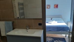 Posteľ alebo postele v izbe v ubytovaní B&B CASA MARTINA