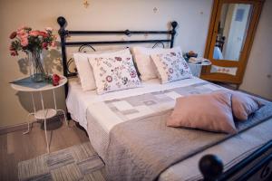 a bedroom with a bed with a vase of flowers at B&B Cascina Ciapilau in Asti