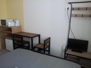 Postel nebo postele na pokoji v ubytování Les Chambres Studios de Pleslin-Foucher