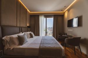 Postel nebo postele na pokoji v ubytování Callistos Hotel & Spa