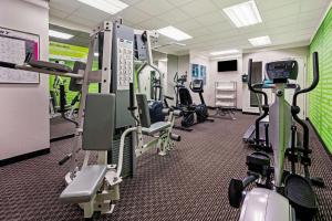 a gym with several treadmills and exercise bikes at La Quinta by Wyndham Tacoma - Seattle in Tacoma
