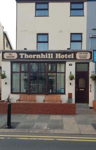 a front view of a thompson hotel on a street at Thornhill Blackpool in Blackpool