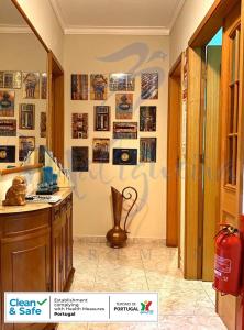 a kitchen with a sink and a vase on the wall at Maligueira Apartment in Leiria