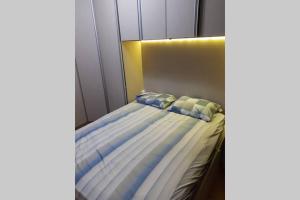 Кровать или кровати в номере Apartamento Térreo com Jardim e Garagem