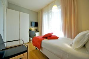 เตียงในห้องที่ Hotel Mercure Milano Solari