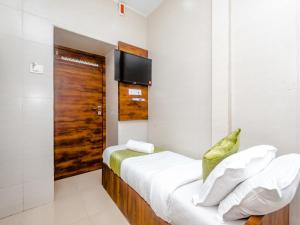 Tempat tidur dalam kamar di Hotel Alfa Heritage