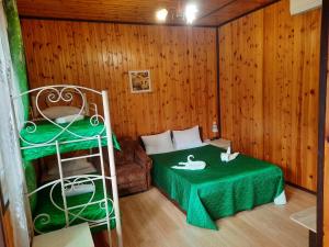 Cama o camas de una habitación en Madlen Cottages