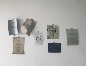a wall with signs and drawings on it at Zhe·Yi Boutique Guesthouse in Beijing