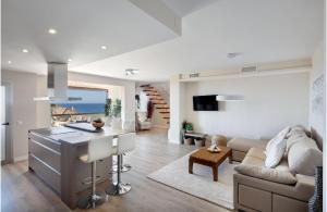 A television and/or entertainment centre at AMAZING DUPLEX NEXT TO THE BEACH IN MARBELLA