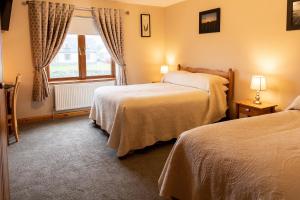 Voodi või voodid majutusasutuse Twin Peaks B&B toas