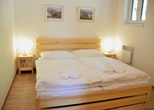 Posteľ alebo postele v izbe v ubytovaní Resort Erich