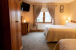 Postel nebo postele na pokoji v ubytování Twin Peaks B&B